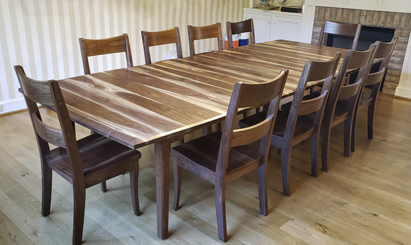 Walnut blend extension table with ladder back chairs