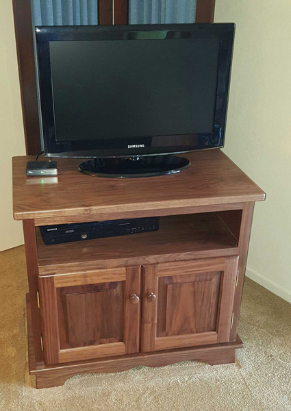 Small wood outlet entertainment center